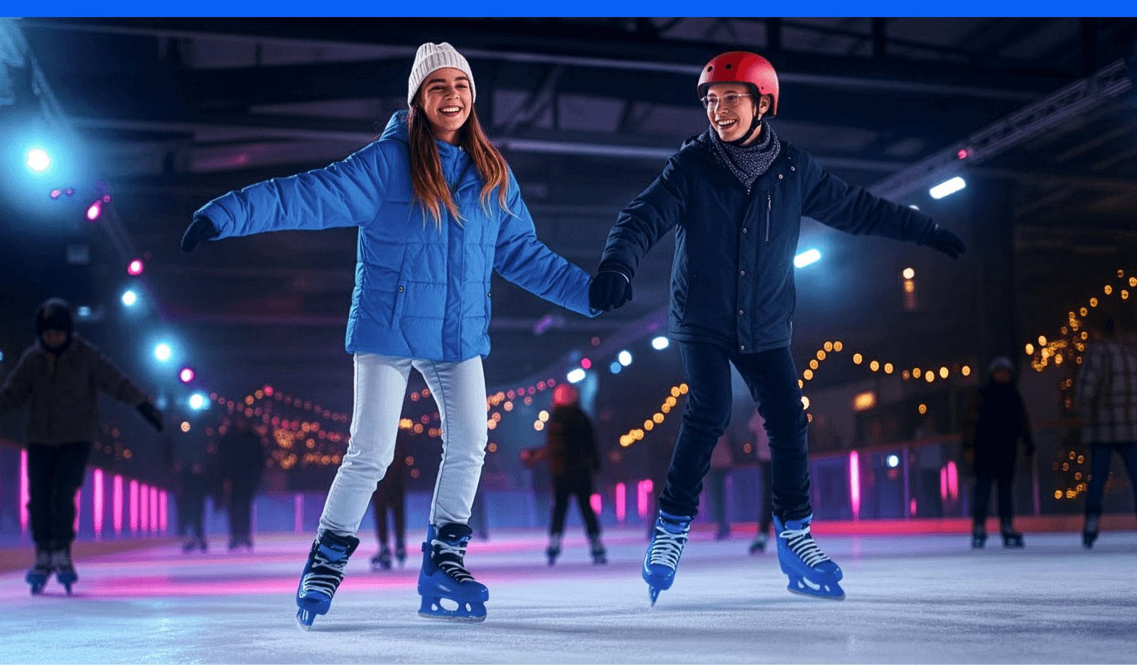A couple smiling and skating at an ice rink