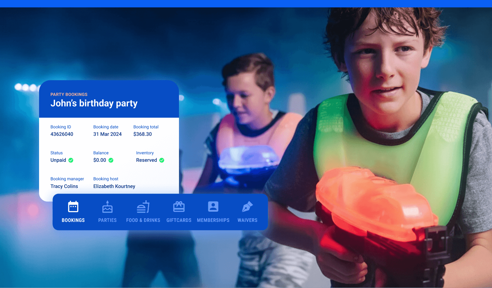 Two young boys playing laser tag with colorful equipment