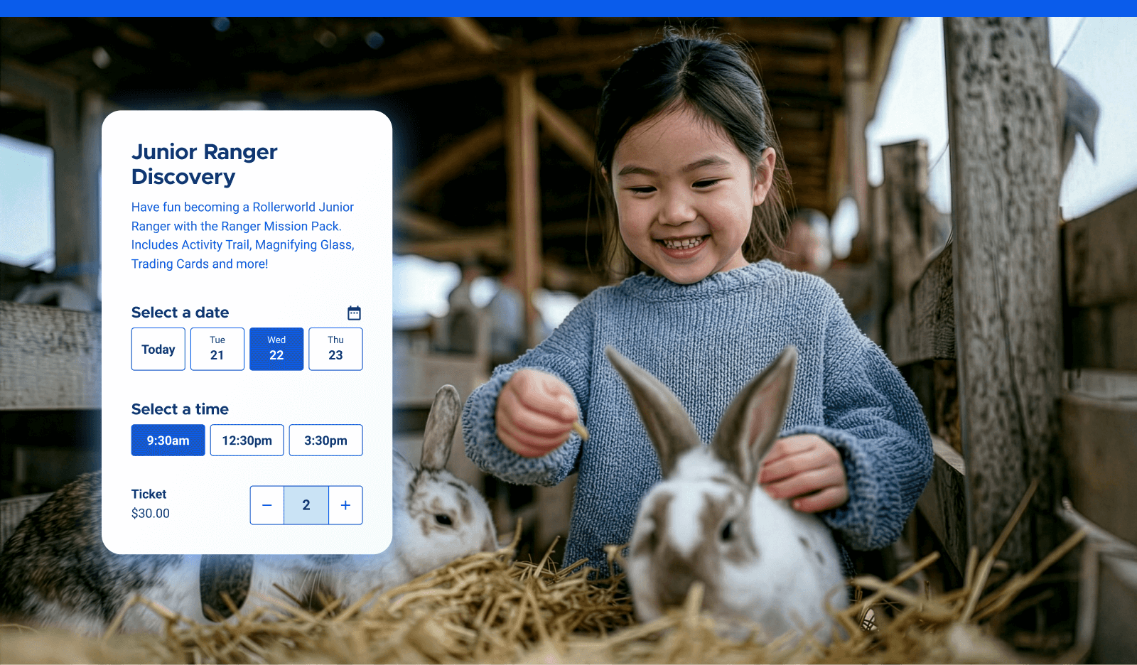 A young girl at a petting zoo with two bunnies